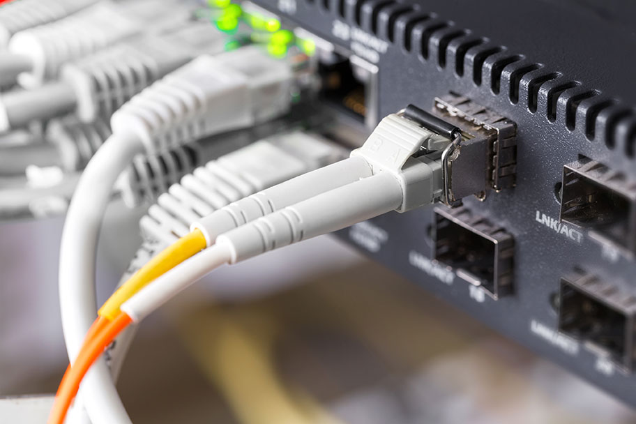 Close-up of high-speed fibre network switch and cables